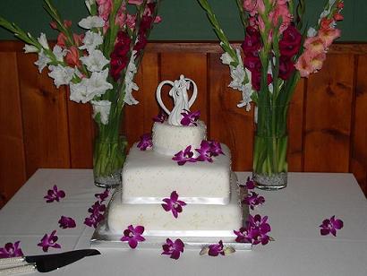 The bride wanted Orchids cascading and all around the cake table
