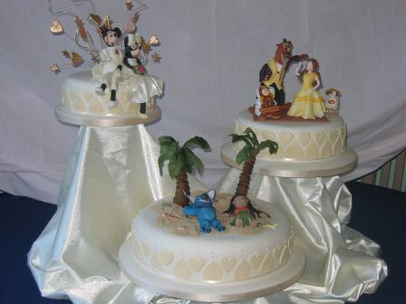 It has three humorous wedding cake toppers, all based on Disney 