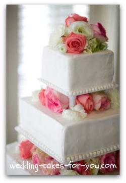 Square wedding cakes with pink roses