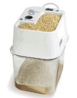 Grain mill for grinding the wheat berries