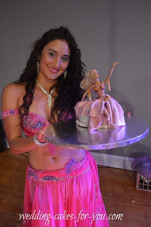 Beautiful bellydancer with a cake