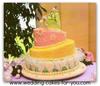 A whimsical wedding cake embellished with fondant